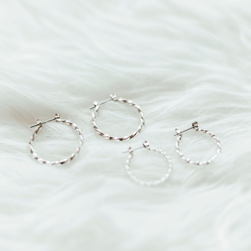 2 sets of twisted silver hoops